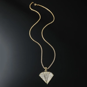 Hip-hop gold twisted rope chain with iced out sparkling triangle pendant on black background