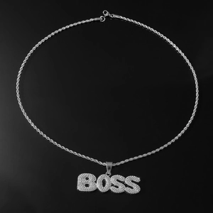 Close-up of sparkling BOSS letter pendant with micro-paved rhinestones on a silver rope chain