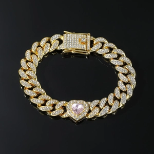 Iced-out Cuban link bracelet in gold with pink heart stone and white cubic zirconia