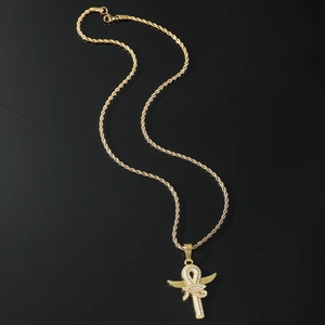 Hip hop gold Ankh cross pendant necklace with sparkling diamonds on black background