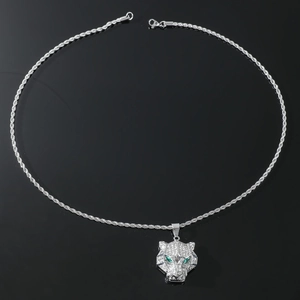 Close-up of hip-hop leopard pendant with sparkling crystals and vivid green eyes