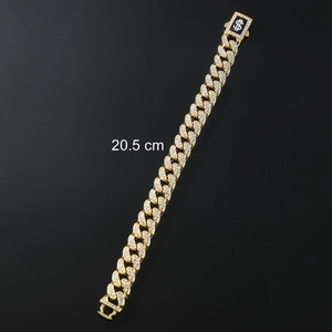 Close-up of 13mm gold plated iced out Cuban link bracelet with dollar sign clasp