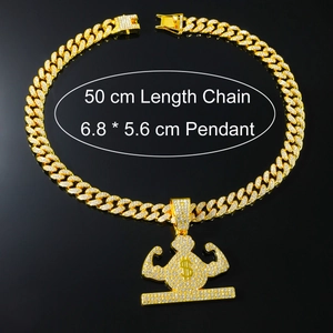 Close-up of golden hip hop money bag pendant with iced-out crystals and 50cm cuban chain