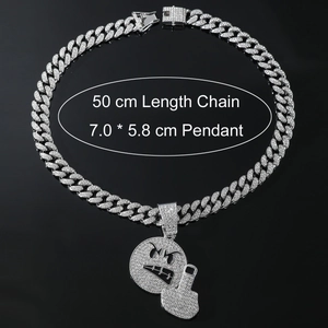 Iced-out emoji pendant with middle finger gesture on heavy hip-hop Cuban link chain