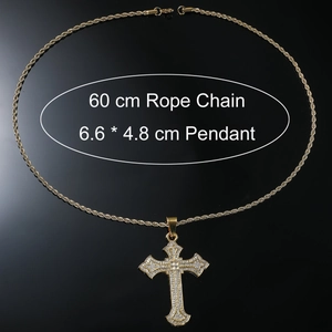 Macro view of iced out gold cross pendant necklace with 60cm rope chain on black background