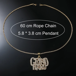 Detail of 60cm gold rope chain with a 5.8x3.8 cm Grind Hard iced out pendant