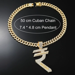 Close-up of hip hop gold Cuban link chain and oversized rupee symbol pendant with full zircon