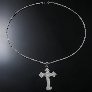 Close-up of hip hop silver cross necklace with full cubic zirconia and rope chain