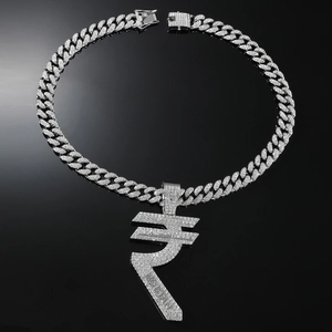 Macro detail of iced-out silver Indian Rupee symbol pendant on thick Cuban link chain