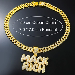Detail view of iced-out MACK RICH hip hop pendant with 50cm golden cuban chain