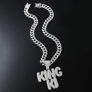 Iced out silver Cuban chain necklace with a KING KI sparkling letter pendant