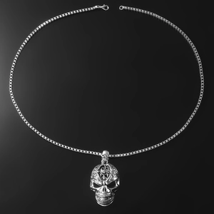 Silver skull pendant necklace with intricate patterns and box chain for punk style