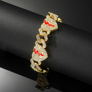 Hiphop iced-out cuban link bracelet with red enamel heart pendants on a display stand