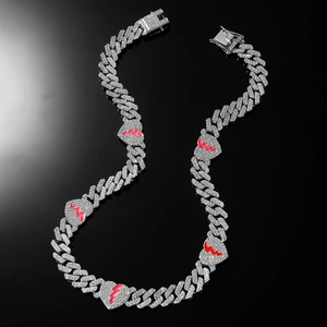 Hip hop iced out Cuban link necklace with red broken heart pendants on black background