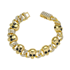 Collana a catena cubana placcata oro con teschi tempestati di cristalli e occhi di pietre nere