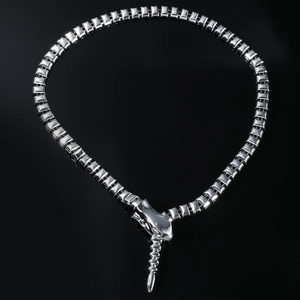 Detailed macro shot of silver snake-shaped collar necklace with polished square metal links