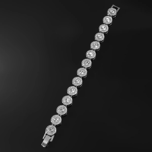Macro detail of silver hiphop chain bracelet with round sparkling crystal inlay