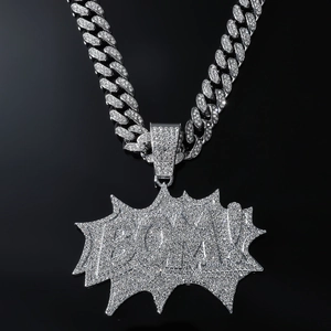Iced-out BOOM letter pendant on a Cuban link chain with sparkling silver rhinestones