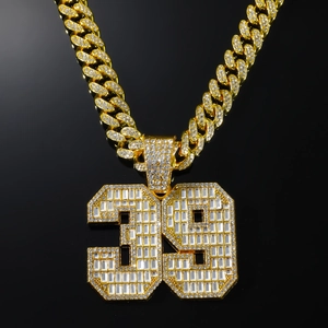 Iced out gold number 39 pendant with glass crystals on a thick cuban link chain