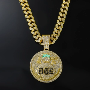 Collier avec pendentif BGE sac d'argent et chaîne cubaine épaisse dorée