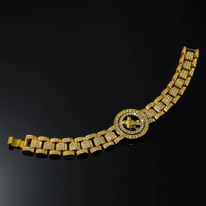 Bracciale a catena hip hop dorata con ciondolo a croce rotante e zirconi bianchi lucidi