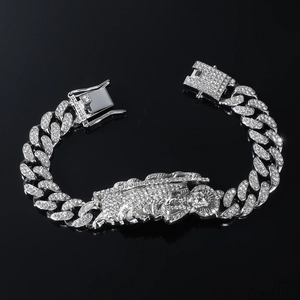 Silver iced-out Cuban chain bracelet with St. Jude pendant in hip hop style