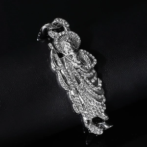Detailed macro of Saint Jude pendant featuring full white diamond pavé on Cuban link