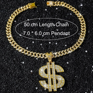 Detail shot of iced-out gold dollar sign pendant with 7.0x6.0cm dimensions and Cuban chain