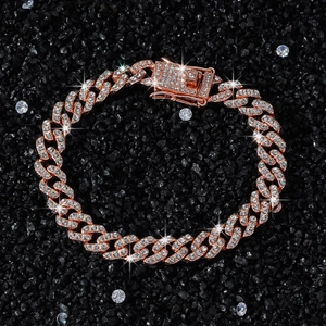 9mm rose gold Cuban link bracelet with full diamond pavé on black stone background