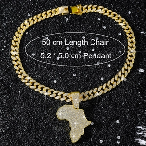 Macro detail of 50cm golden Cuban link chain with 5.2cm iced-out Africa map pendant