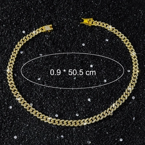 Detail of 9mm gold Cuban chain with white zirconia stones showing length and width