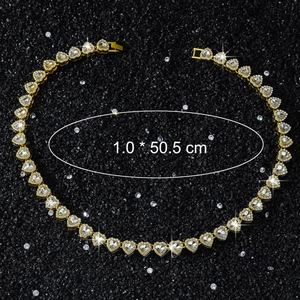 Detail showing 10mm wide heart tennis chain with gold plating and white zircons
