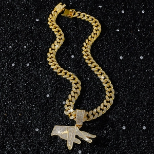 Hip hop gold plated Cuban link necklace with iced out hand gesture pendant on dark sand