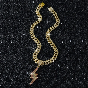Hip hop gold Cuban chain necklace featuring pink and white lightning bolt pendant set in black