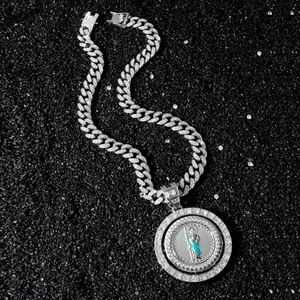Hip hop style silver Cuban chain necklace with Saint Jude iced out pendant on dark stones