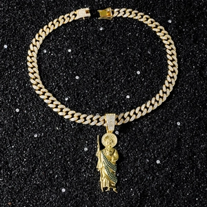 Detailed view of Saint Jude pendant with micro-paved diamonds on gold Cuban chain