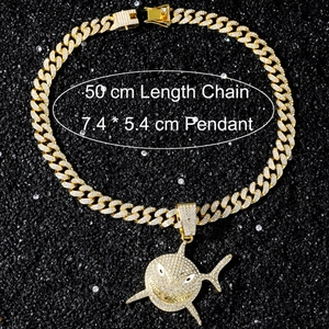 Detailed view of hip hop shark pendant with paved crystals on 50cm gold Cuban chain
