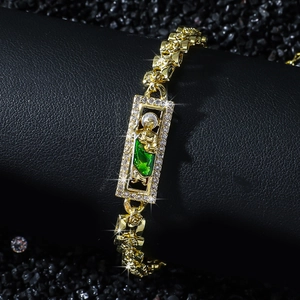 Gold St. Jude St. Jude bracelet with green gemstone and 3D rose flower chain links