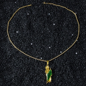 Detail of St. Jude pendant in gold finish with green robe and braided rope chain