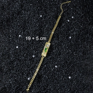 Macro detail of St. Jude religious pendant on golden Cuban chain bracelet, 19+5 cm length