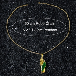 Detailed view of Saint Jude pendant with 60cm gold rope chain on black sand