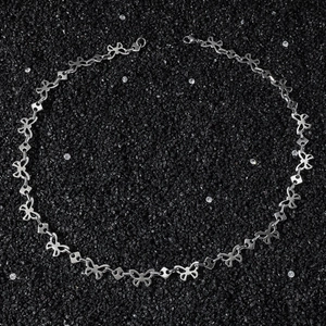 Hip-hop style stainless steel butterfly square link chain necklace on black textured stone