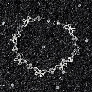 Hip hop style stainless steel butterfly link chain bracelet on black crystal background