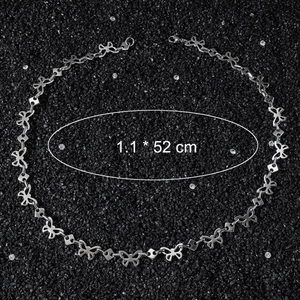 Hip hop butterfly stainless steel choker necklace for women on black gravel background