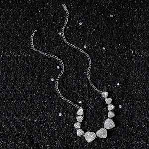 Classic hip-hop iced out heart link necklace with dazzling crystals on black background