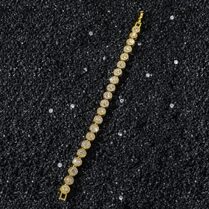 Detail view of 8mm gold tennis bracelet with brilliant round-cut zirconia and fold-over clasp