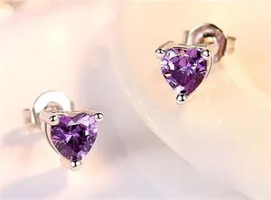 Detailed view of purple heart-shaped S925 sterling silver stud earrings with 3-prong setting
