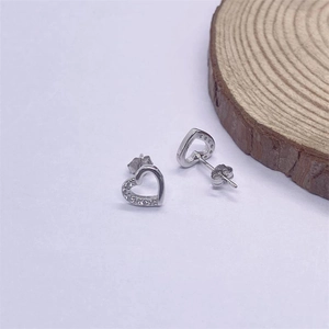 Elegant hollow S925 sterling silver heart earrings with sparkling crystal accents