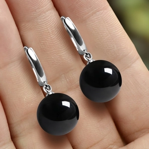 Elegant S925 sterling silver drop earrings featuring polished black onyx round beads