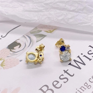 Elegant S925 silver stud earrings with blue and clear gemstones on a gift card